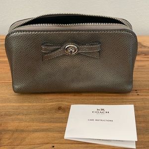 Coach makeup bag / small bag in dark silver metallic color.